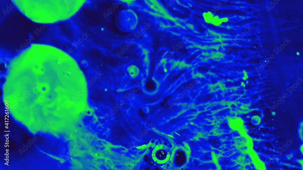 Abstract colorful fluid art painting background. Pouring technique. Liquid marble. Alcohol inkscape. Macro top view. Green and blue color palette. Abstract colorful fluid art painting background. Pouring technique. Liquid marble. Alcohol inkscape. Macro top view. Green and blue color palette.