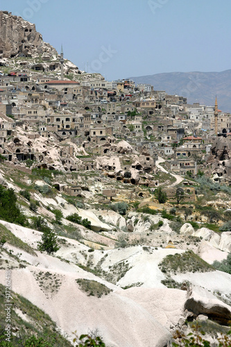 Special stone formation and houses near the Uchisar Castle in Cappadocia, Nevsehir, Turkey. Cappadocia is part of the UNESCO World Heritage Site.