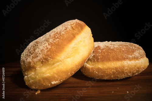 Close up view over fresh baked doughnuts - macro shot photo