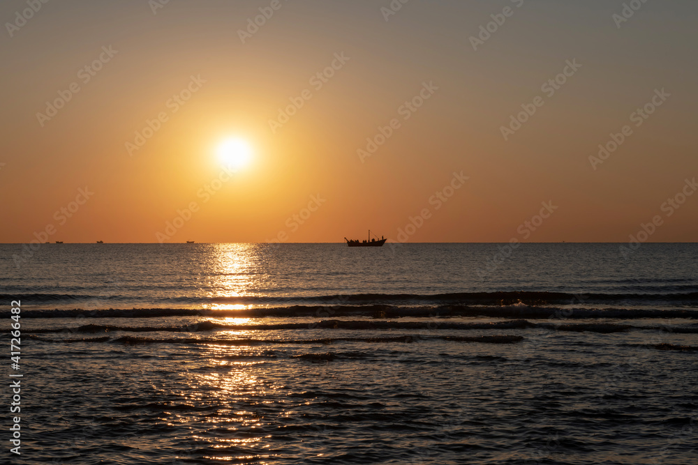 ocean boat in sunrise
