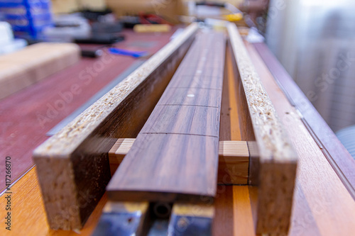 In the workplace of the master of repair and manufacture of guitars. Soft Focus