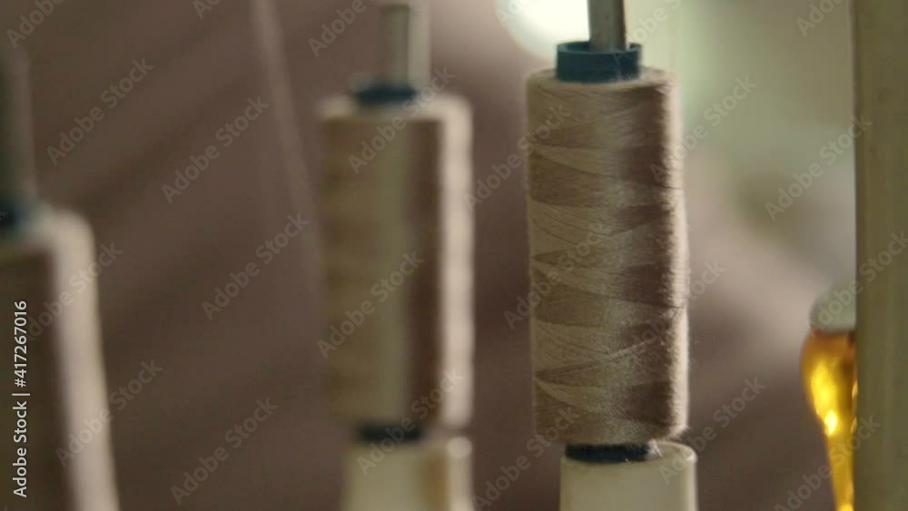 Vidéo Stock Closeup of a Spool with Thin Thread on Working a Vintage