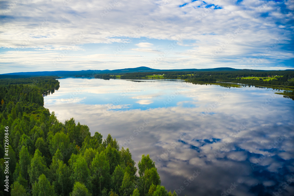 Reflection of sky in lake in northern Sweden