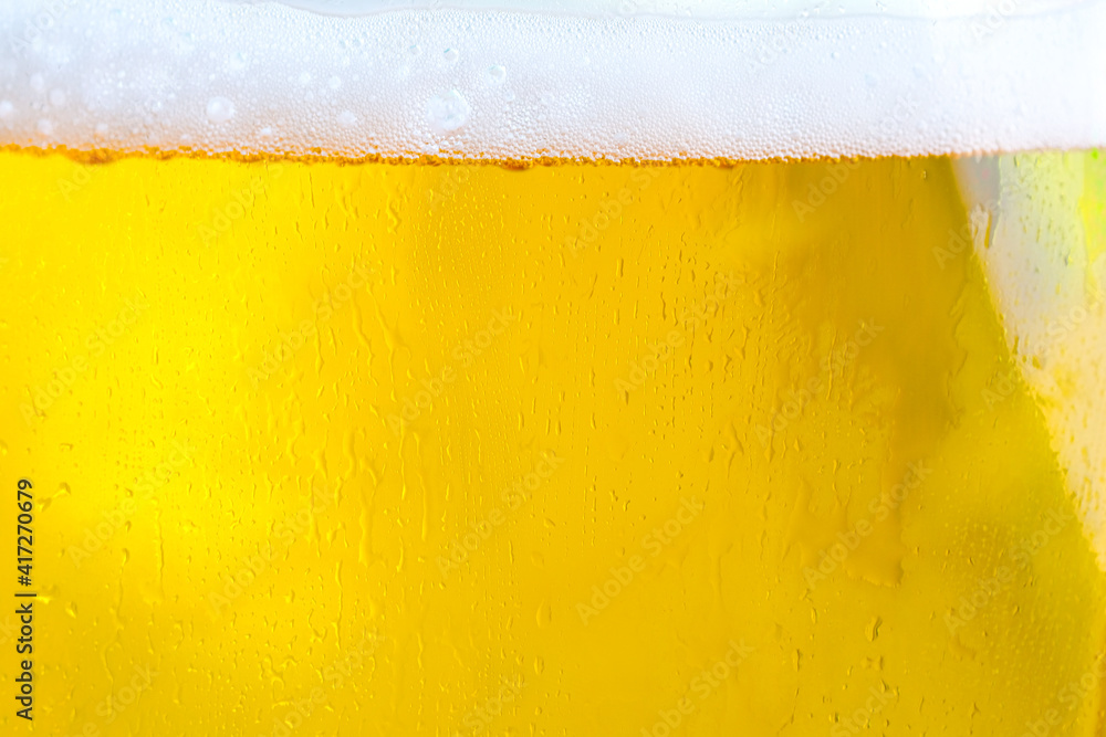 Background Cool beers with beer bubbles on top a glass at the party Background Cool beers with beer bubbles on top a glass at the party