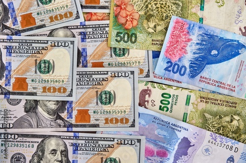 Fotografie dollar and Argentine pesos