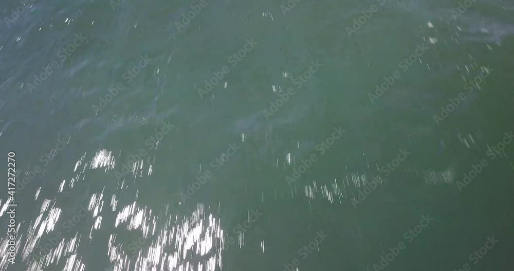 Dramatic Cinematic Aerial View of Ocean Waves and Skyine on a Sunny Summer Day. Bali Island, Indonesia. Dynamic Action Tilt Up Drone Shot Dramatic Cinematic Aerial View of Ocean Waves and Skyine on a Sunny Summer Day. Bali Island, Indonesia. Dynamic Action Tilt Up Drone Shot