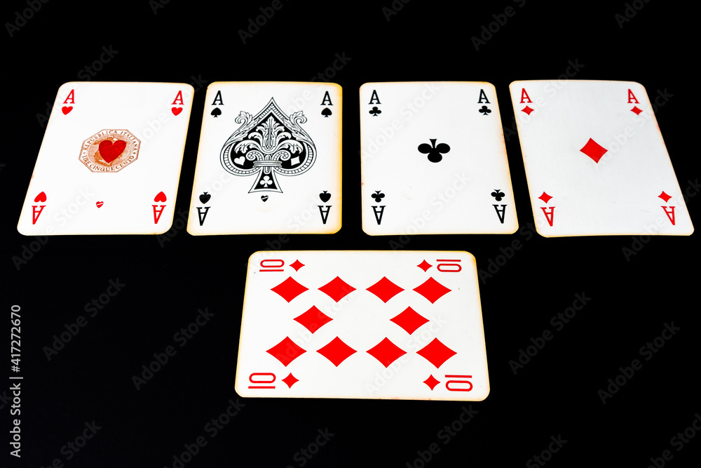 Obraz premium Poker of aces on a black surface. concept card games, gambling