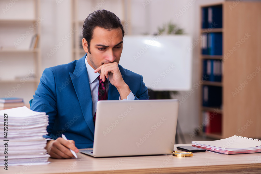 Two employees working in the office Two employees working in the office