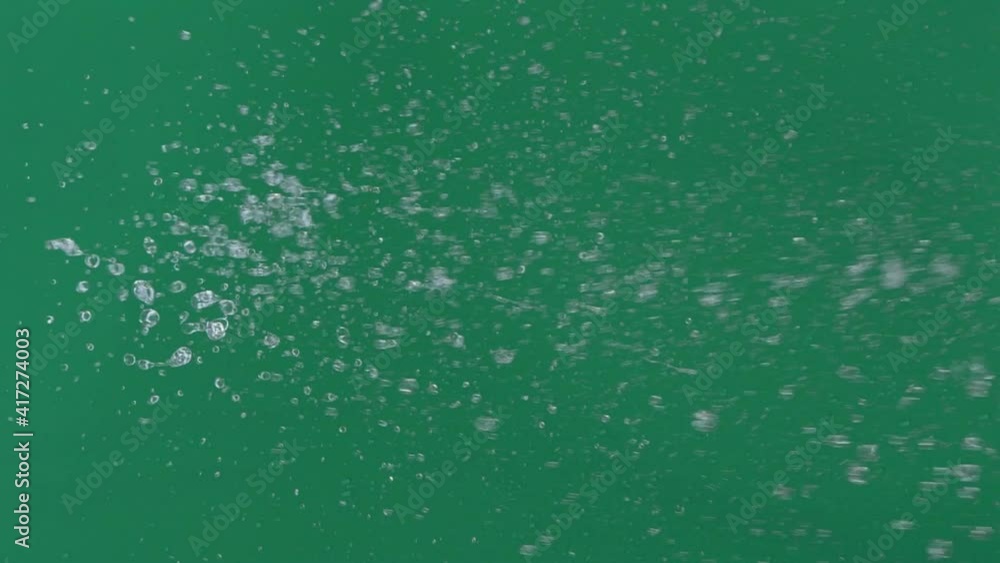 Slow motion of abstract fountain water over green screen chroma key background Slow motion of abstract fountain water over green screen chroma key background