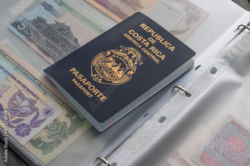 Costarican Passport on collection of money from many different countries photo