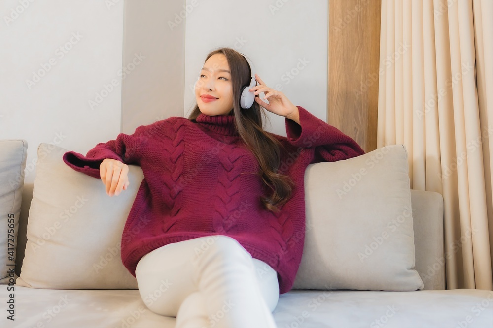 Portrait beautiful young asian woman use headphone for listen music Portrait beautiful young asian woman use headphone for listen music