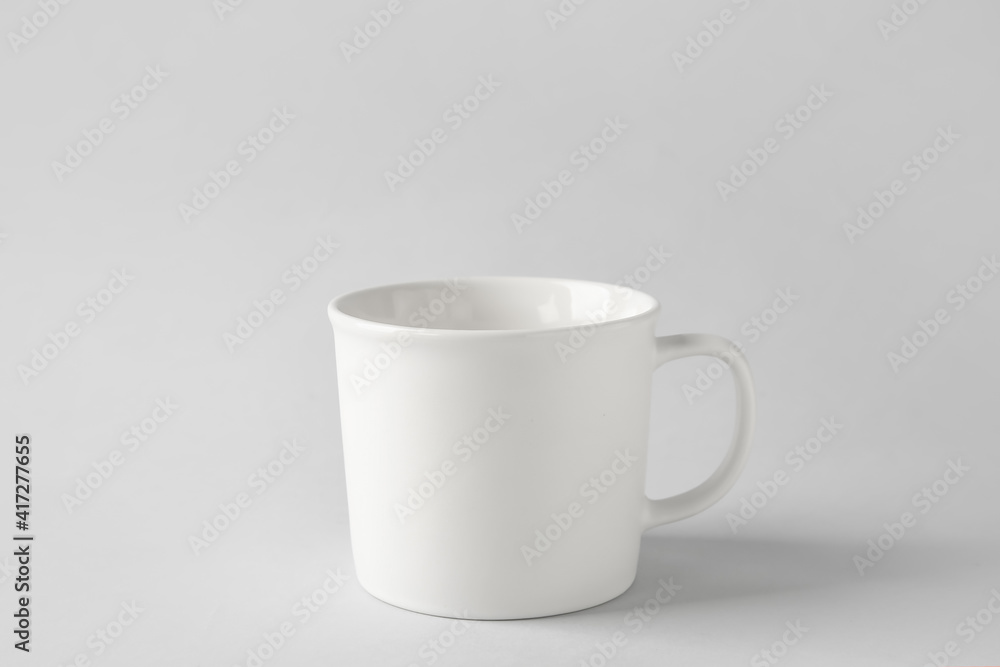 Empty cup on light background Empty cup on light background