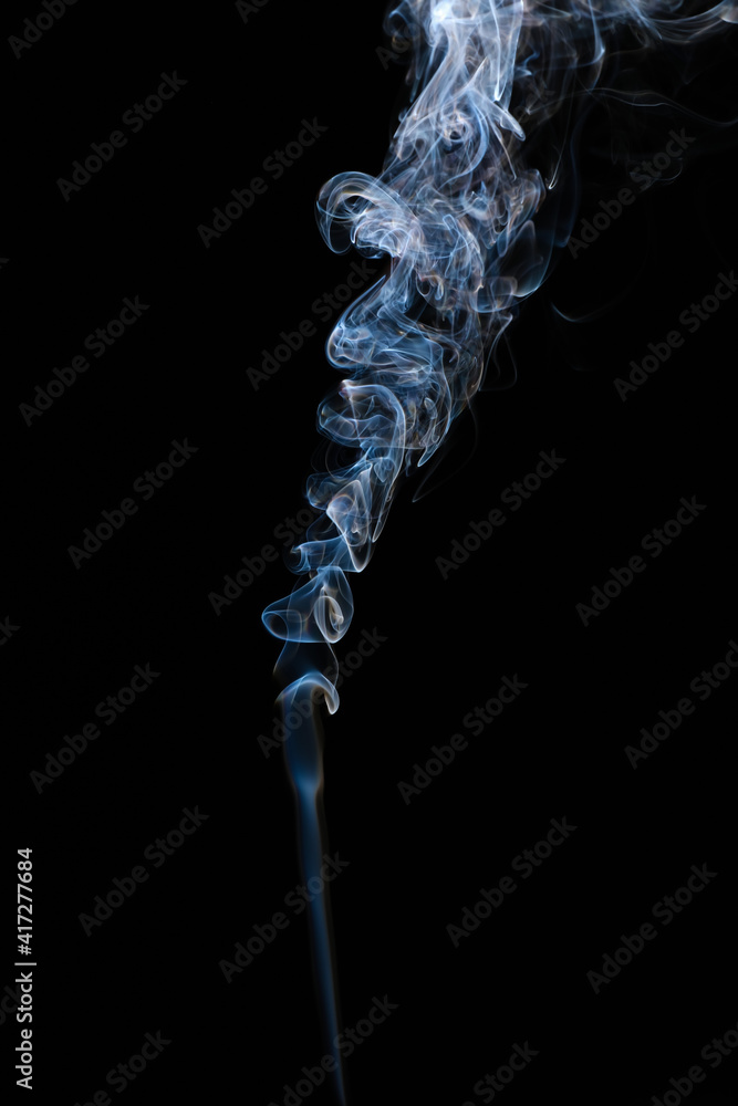 Cigarette smoke on dark background Cigarette smoke on dark background