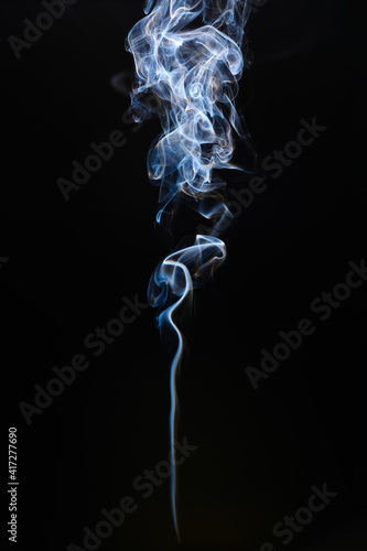 Cigarette smoke on dark background