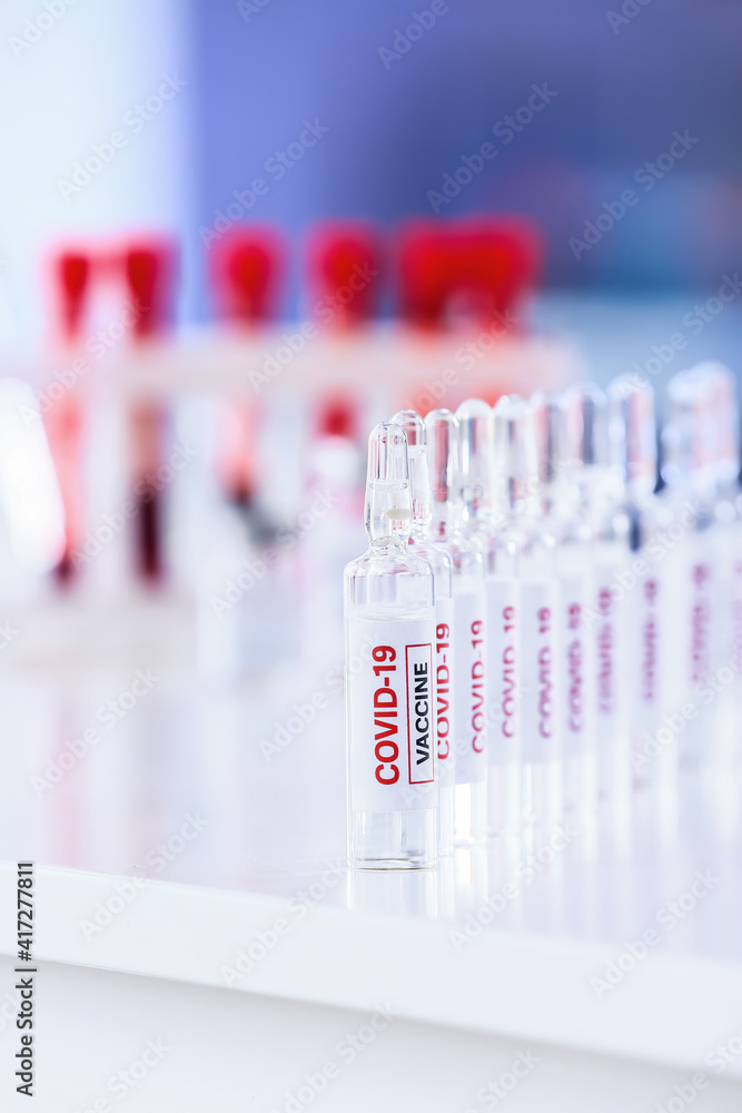 Samples of vaccine against COVID-19 on table in laboratory