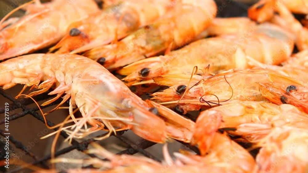 Grilling prawns on stove , Thai street food Grilling prawns on stove , Thai street food