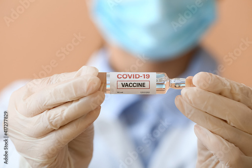 Covid-19 vaccine ampoule he...