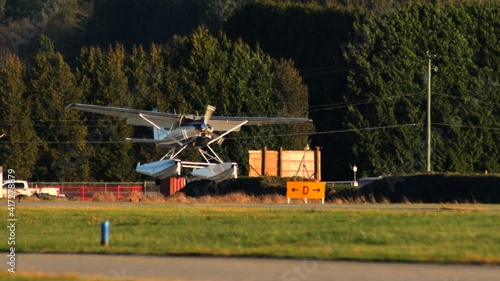 Cessna-182 Plane Approaching To Land On The Runway Of Pitt Meadows Airport In British Columbia, Canada. tracking shot (descend) photo