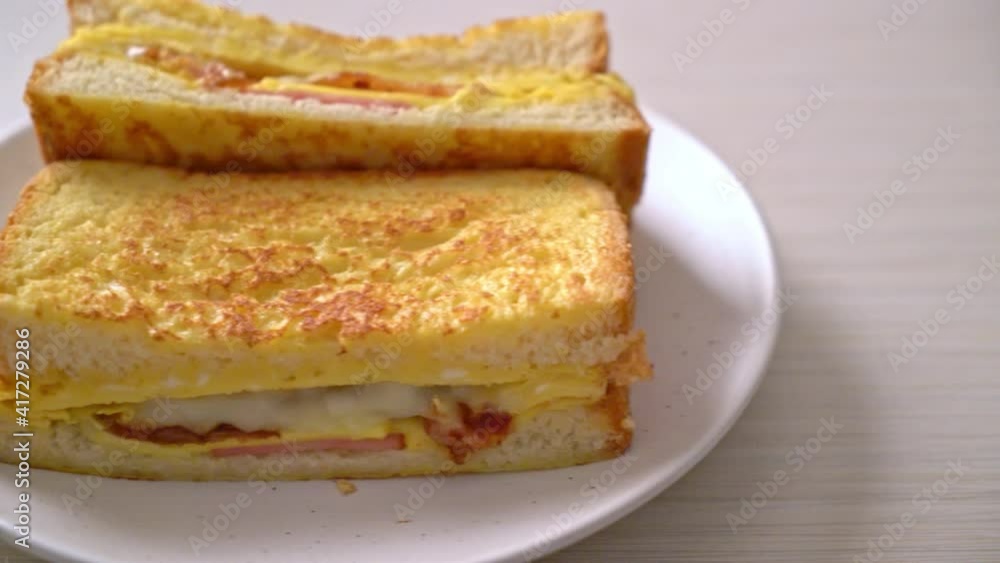 Homemade French toast ham bacon cheese sandwich with egg Homemade French toast ham bacon cheese sandwich with egg