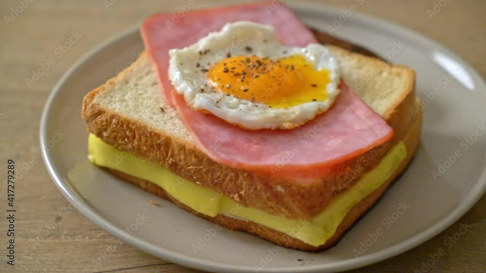 homemade bread toasted cheese topped ham and fried egg with pork sausage for breakfast homemade bread toasted cheese topped ham and fried egg with pork sausage for breakfast