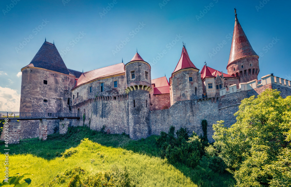 Wonderful morning view of Hunyad Castle (Corvin's Castle). Bright summer cityscape of Hunedoara, Transylvania, Romania, Europe. Romanian castle landmarks. Traveling concept background.