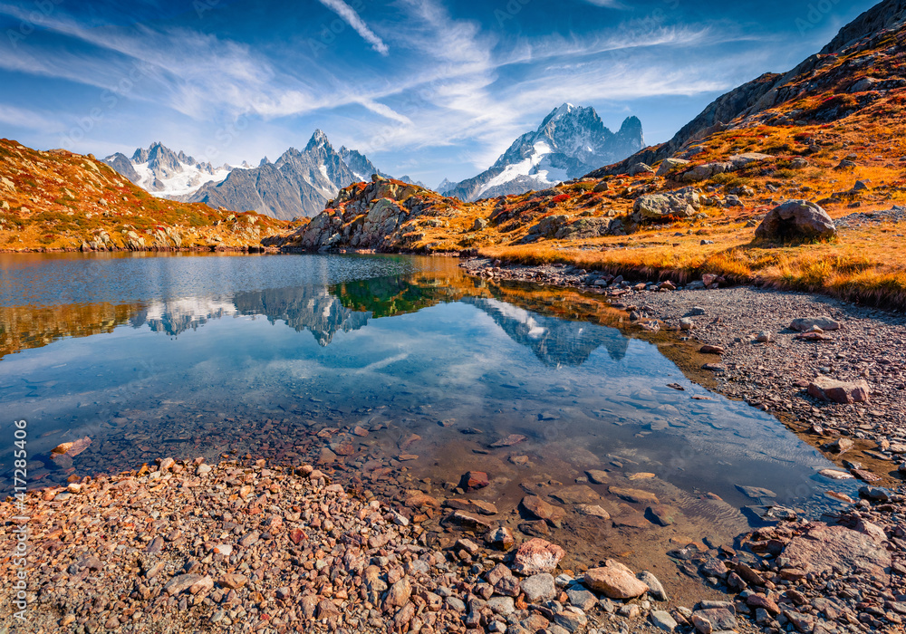 Beautiful autumn scenery. Adorable morning view of Chesery lake/Lac De Cheserys, Chamonix location. Stunning outdoor scene of Vallon de Berard Nature Preserve, Graian Alps, France.