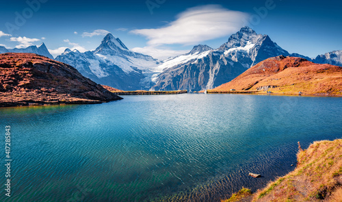 Beautiful autumn scenery. Amazing morning view of Bachalp lake  Bachalpsee   Switzerland. Breathtaking autumn scene of Swiss alps  Grindelwald  Bernese Oberland  Europe.