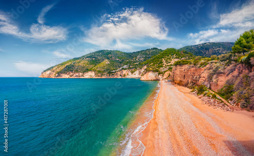 Bright spring view from flying drone of popular tourist destination - Mattinatella beach (Fontana delle Rose). Wonderful seascape of Adriatic seascape, Gargano National Park, Italy, Europe. photo