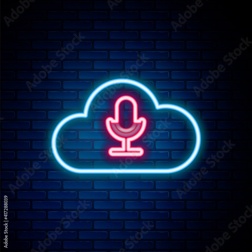 Glowing neon line Music streaming service icon isolated on brick wall background. Sound cloud computing, online media streaming, online song, audio wave. Colorful outline concept. Vector.