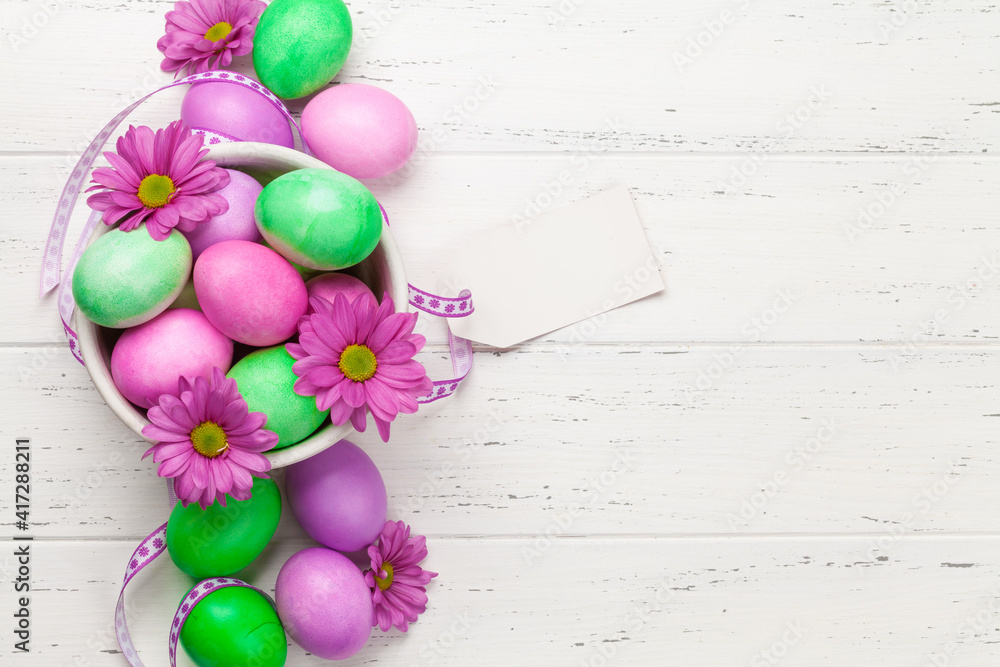 Easter greeting card with colorful easter eggs and flowers Easter greeting card with colorful easter eggs and flowers
