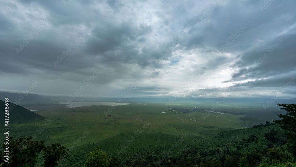 Ngorongoro crater panorama during rainy season. World heritage site of Tanzania full of wildlife.