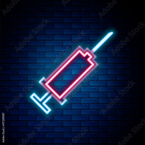 Glowing neon line Syringe icon isolated on brick wall background. Syringe for vaccine, vaccination, injection, flu shot. Medical equipment. Colorful outline concept. Vector.