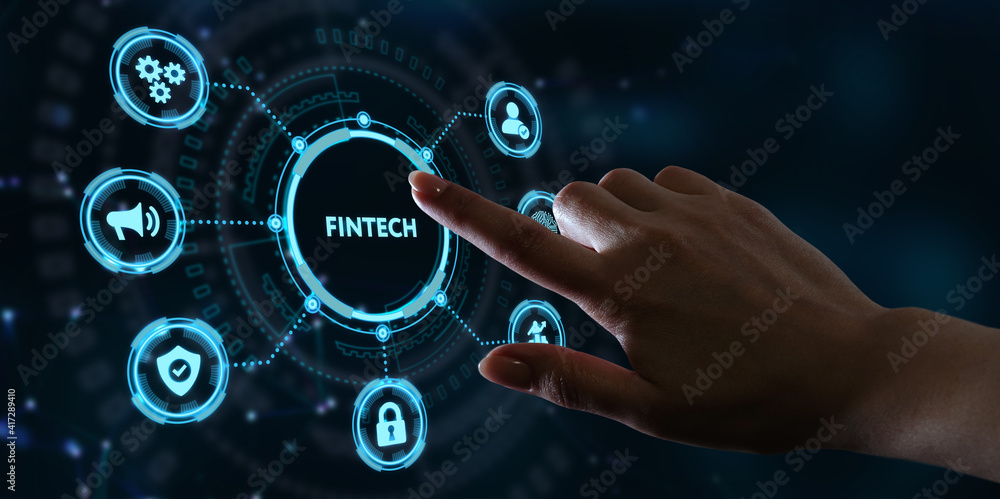 Fintech -financial technology concept.Young businessman select the icon Fintech on the virtual display. Fintech -financial technology concept.Young businessman select the icon Fintech on the virtual display.