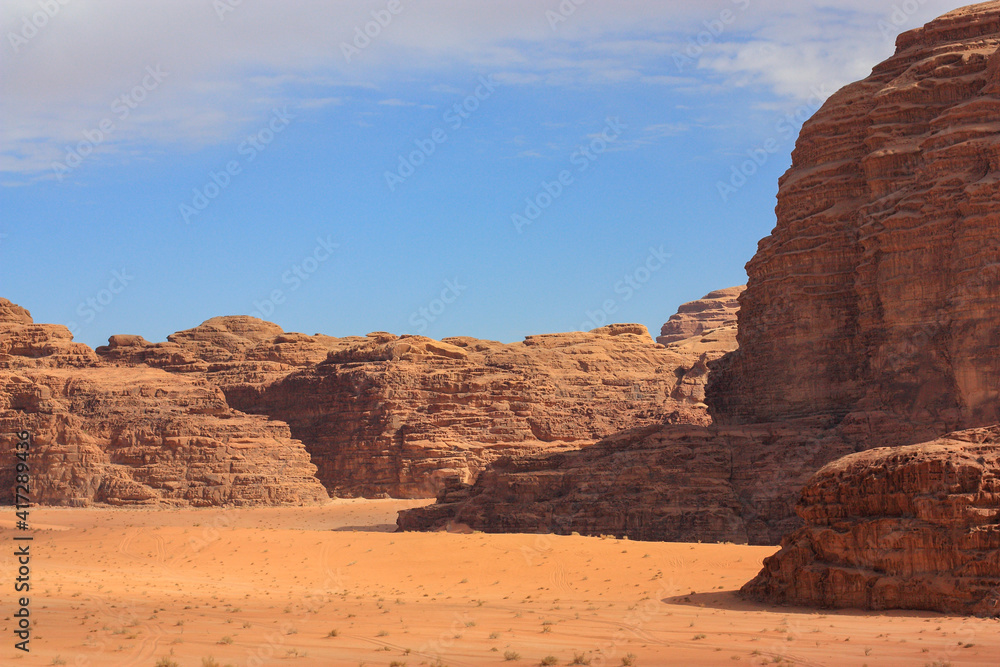 beautiful red relief mountains in the Wadi Rum desert, Jordan, clear sunny day, contrasting shadows beautiful red relief mountains in the Wadi Rum desert, Jordan, clear sunny day, contrasting shadows
