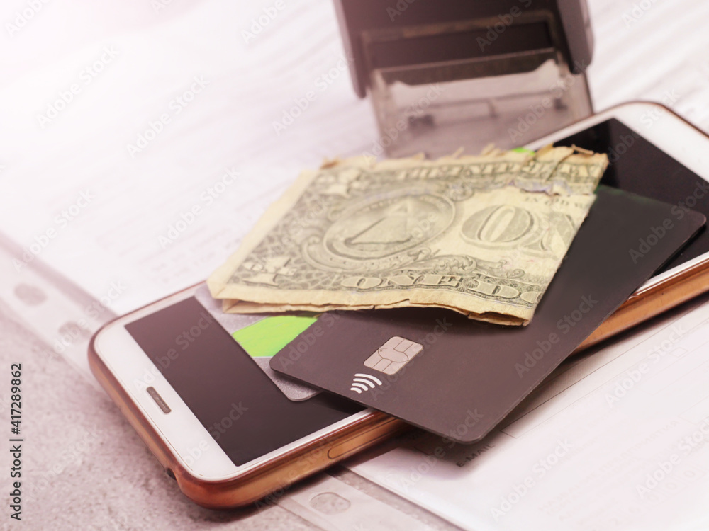 Bank card, dollars and smartphone, credit Bank card, dollars and smartphone, credit