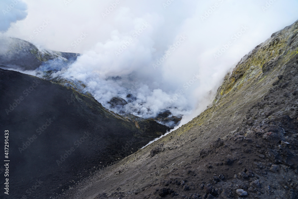 Etna summit and crater trek hiking guided tour concept, Mount Etna summit crater with fumarole active volcanic activity before eruption, Sicily, Italy