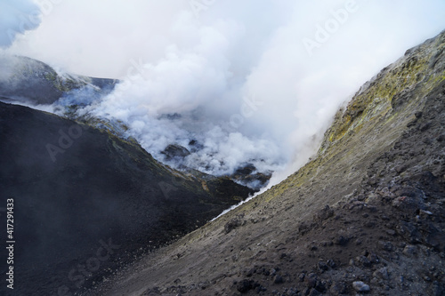 Etna summit and crater trek hiking guided tour concept, Mount Etna summit crater with fumarole active volcanic activity before eruption, Sicily, Italy