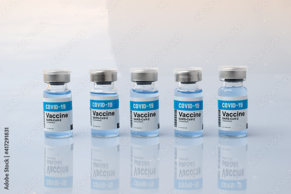 Set of Covid-19 Vaccine bottle with shadow reflection on white background Set of Covid-19 Vaccine bottle with shadow reflection on white background