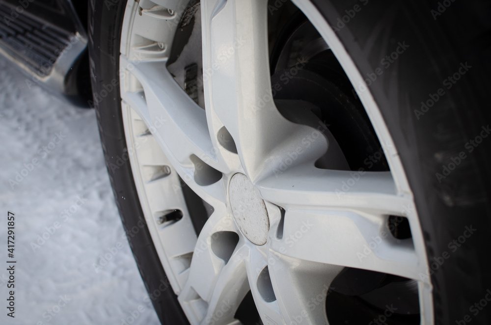 Wheel with a disk from the car in winter.