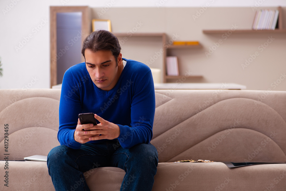 Young sick man suffering at home Young sick man suffering at home