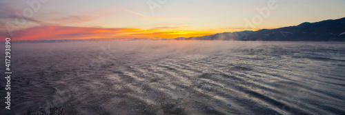 Morning at Baikal - pink dawn and waves driven by the wind © Mikhail Semenov
