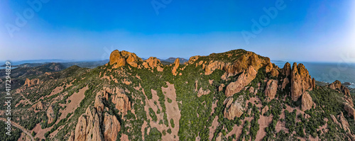 Aerial shots of the red mountains of the Massif de L'essterel in France..