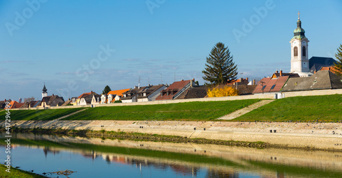 Picturesque urban scape of Gyor buildings on bank of Raba river
