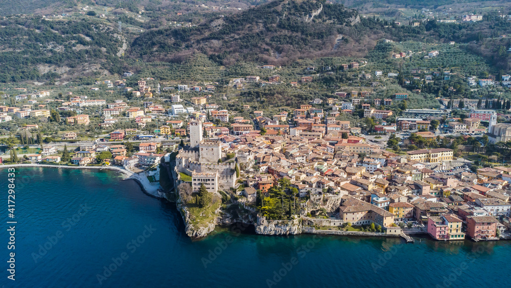 Incredible aerial view of the Medieval Castle of Malcesine on the shores of Lake Garda.