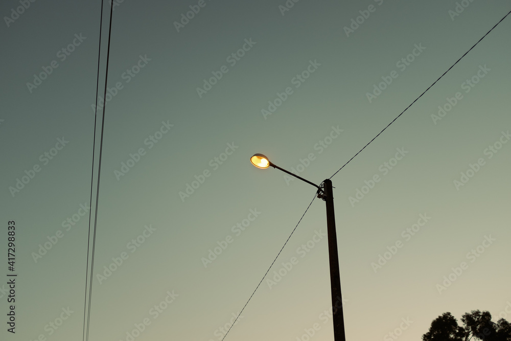 streetlight with cables in morning light
