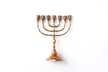 Golden hanukkah menorah on isolated on white background. Jewish holiday banner with copy space. Ancient ritual religious candle menorah