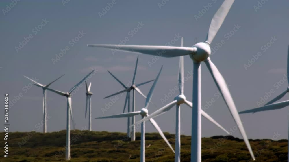 Wind turbine farm blades in the open countryside. Renewealbe energy concept Wind turbine farm blades in the open countryside. Renewealbe energy concept
