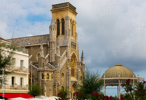 Summer landscape of Biarritz overlooking one of major city landmarks - neo-gothic Sainte Eugenie church, France.. photo