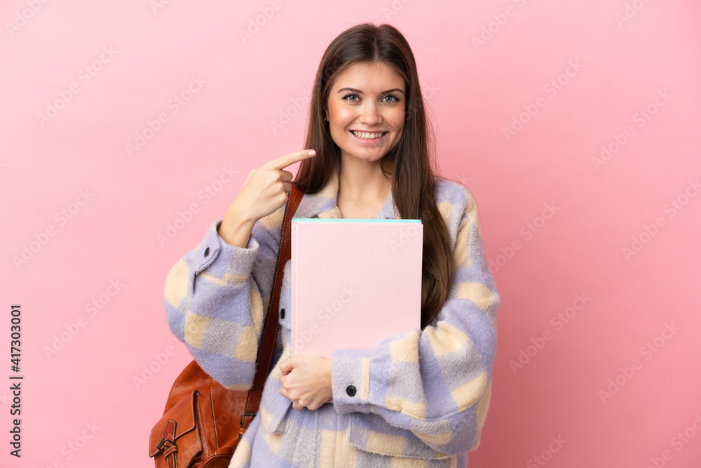 Young student woman isolated on pink background giving a thumbs up gesture Young student woman isolated on pink background giving a thumbs up gesture