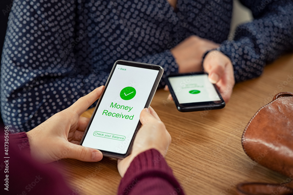 Woman Receiving Digital Money Using Phone Stock Photo Adobe Stock